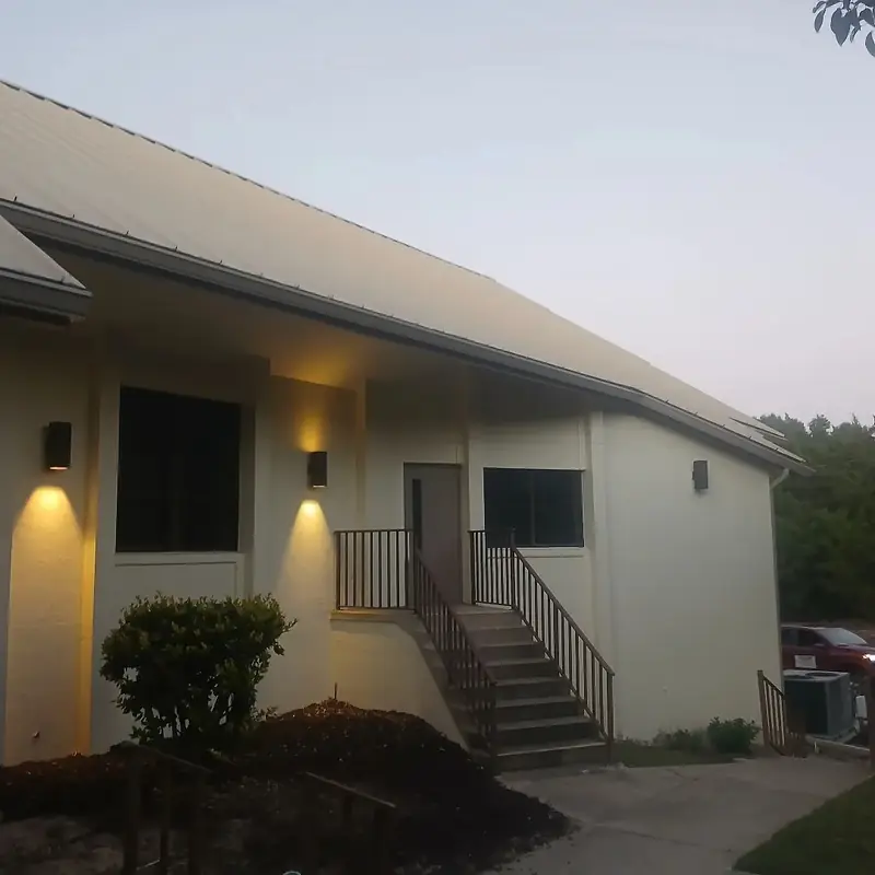 Commercial building with seamless gutters and downspouts