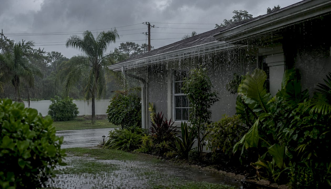 Neighborhood with full pond and rainwater flooding