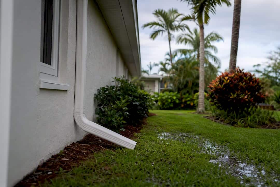 Florida home gutter directing rainwater away