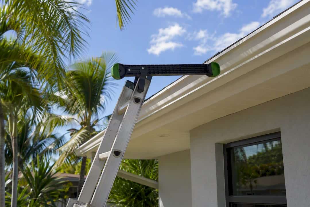 Ladder stabilizer protecting gutters