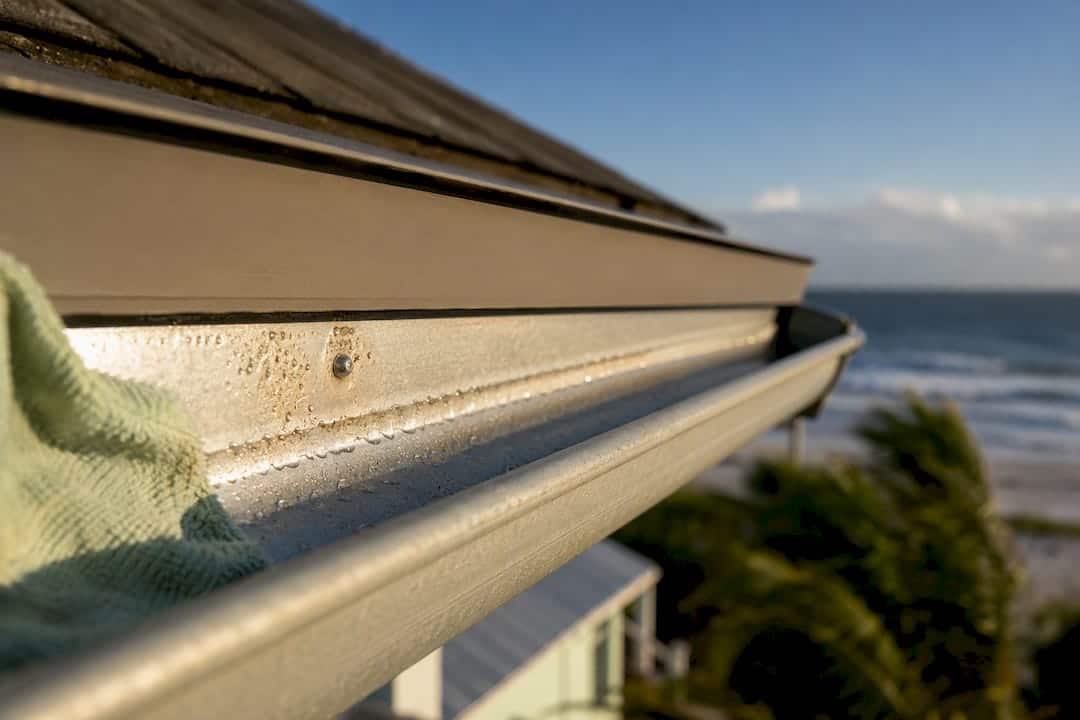Salt corrosion forming on coastal gutter seam